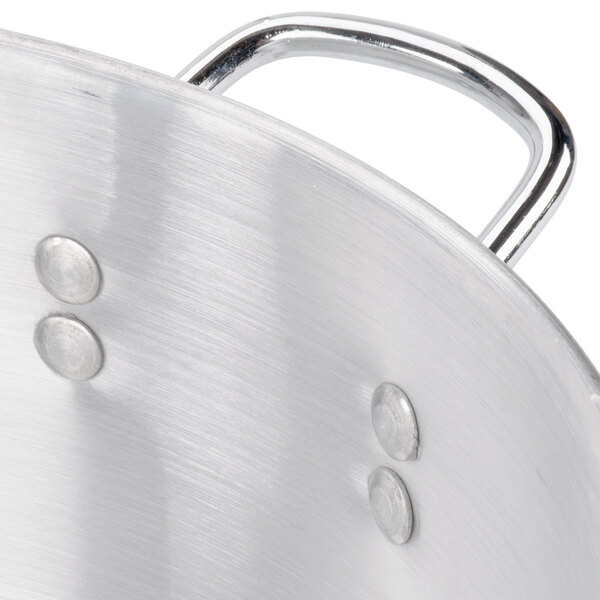 A close-up of a Town aluminum steamer water pan.