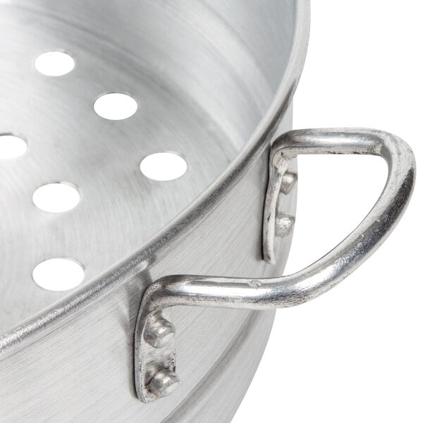 An aluminum Town steamer pot with holes in it.