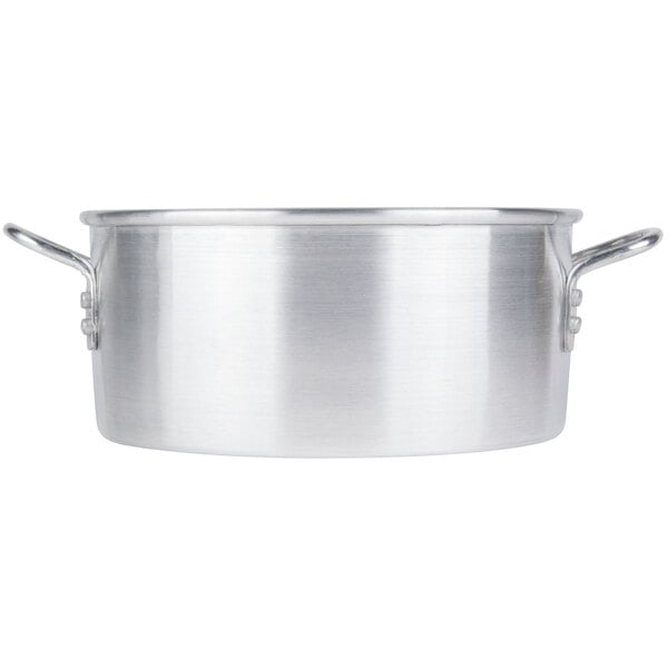 A silver aluminum water pan with handles.