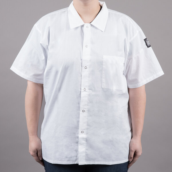 A woman wearing a white Chef Revival cook shirt.