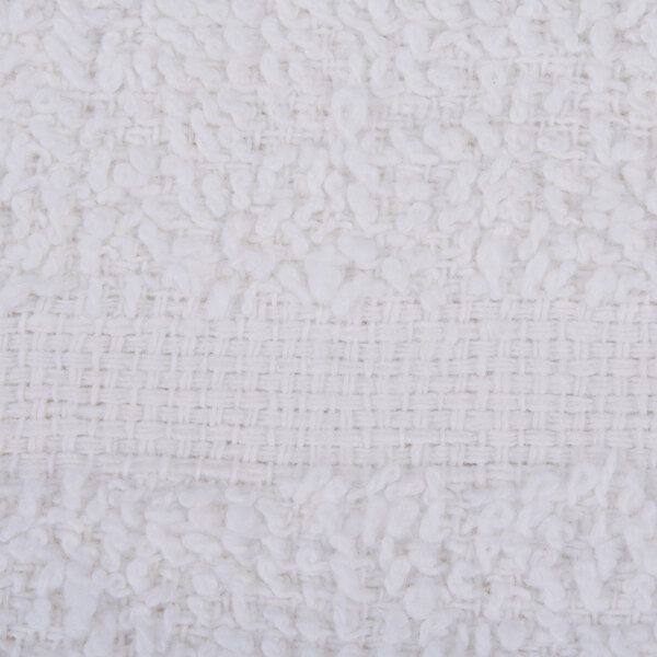 A close-up of a white fabric with small white dots.