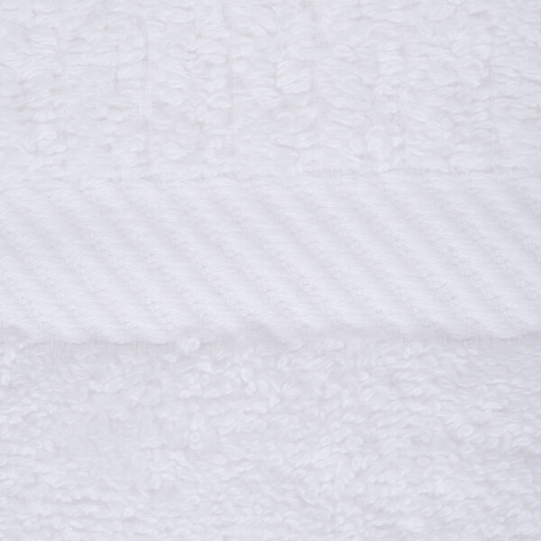 A close up of a white towel with a stripe.
