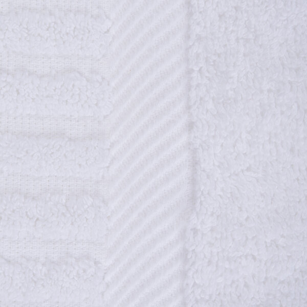 A close-up of a white towel with a stripe.