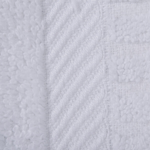 A close-up of a white fabric with a white stripe.