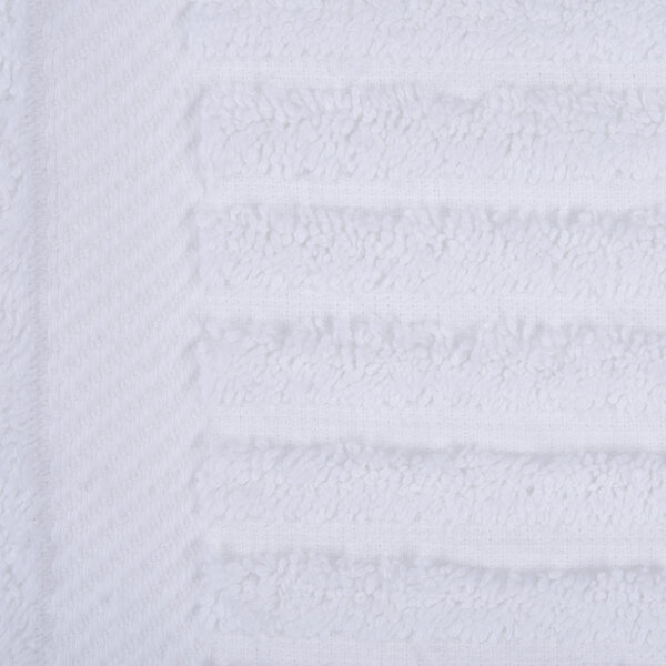A close up of a white Oxford Signature bath towel with a white stripe.