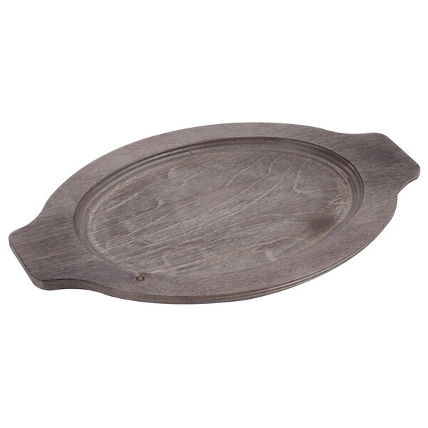 A Lodge oval wood underliner with walnut finish and grip handles.
