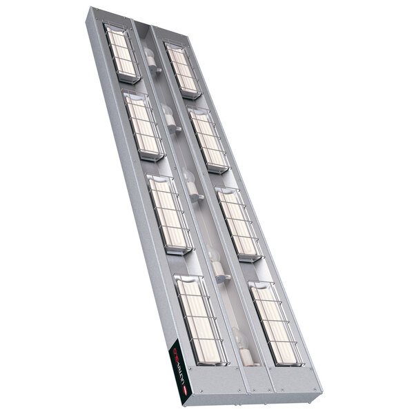 A long rectangular metal rack with many rectangular lights on it.