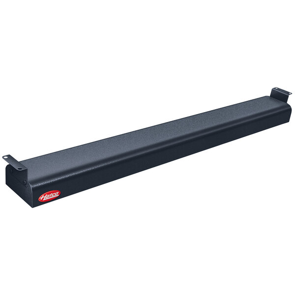A black rectangular Hatco food warmer with red toggle controls.