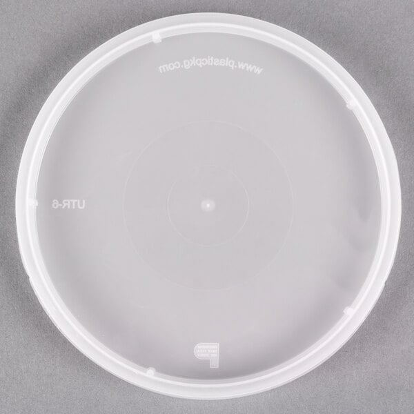 A translucent plastic lid with a tamper evident circle in the center.