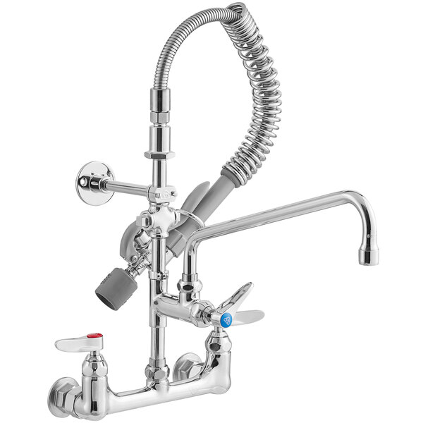A silver T&S wall mounted pre-rinse faucet with a chrome hose and sprayer.