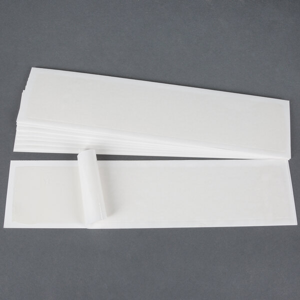 A white plastic Curtron Pest-Pro BL100C with a stack of white paper