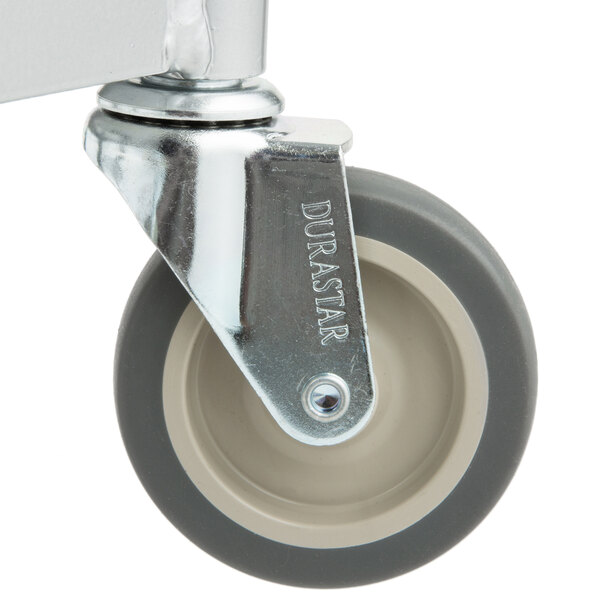 A close-up of a grey and white castor wheel.