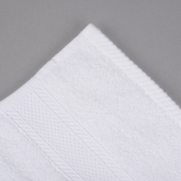 A close-up of a white Oxford Miasma hand towel.