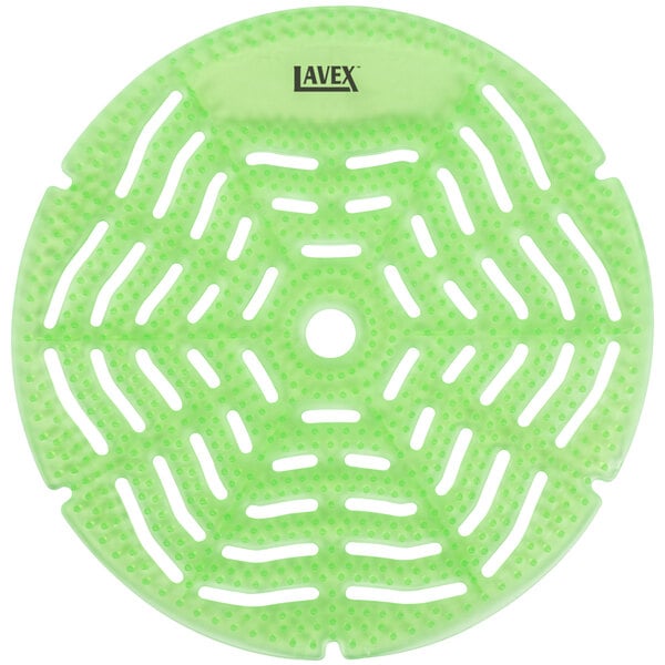 A green circular plastic urinal screen with holes and a white circle in the middle.