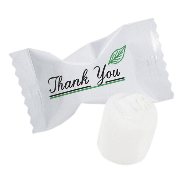 A white candy in a clear wrapper with the words 'Thank You' and a green leaf design printed on it.