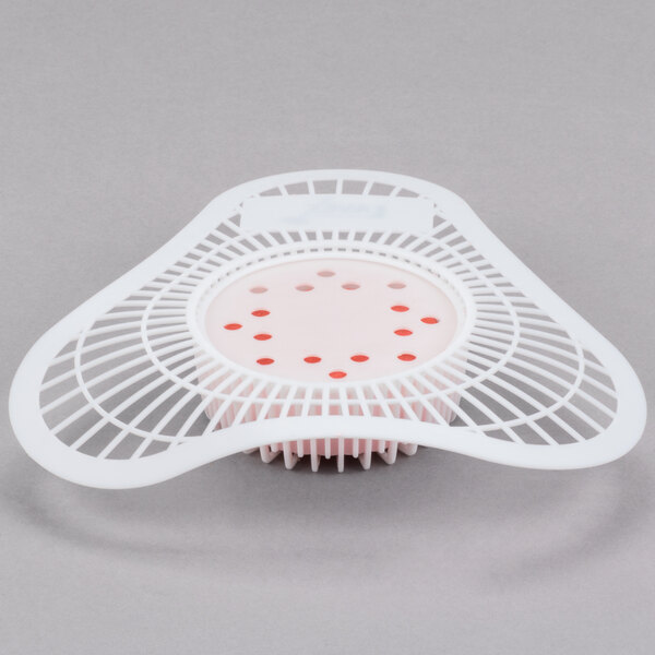 A white plastic dish with a white circle containing red dots.