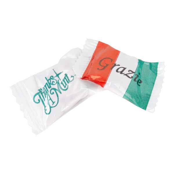 Two individually wrapped mints, one with 'Thanks A Mint' written on the wrapper and the other with 'Grazie' and an Italian flag design.