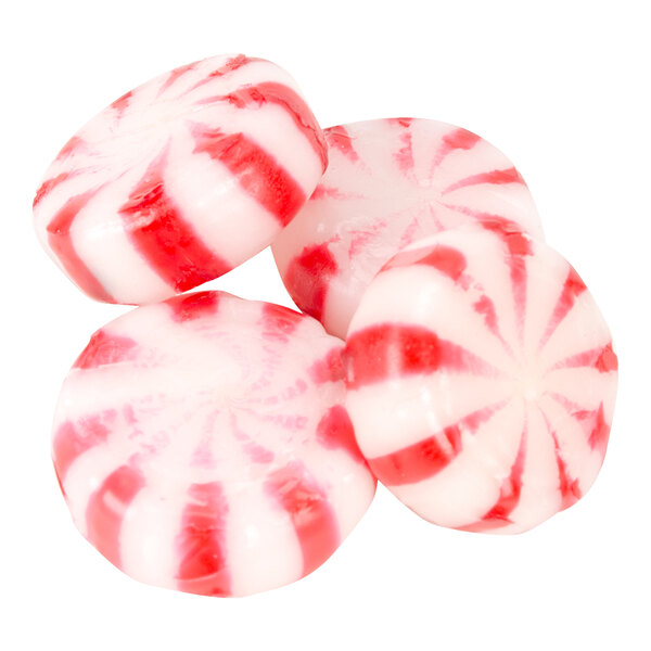 Four round peppermint candies with red and white swirled stripes are shown against a white background.