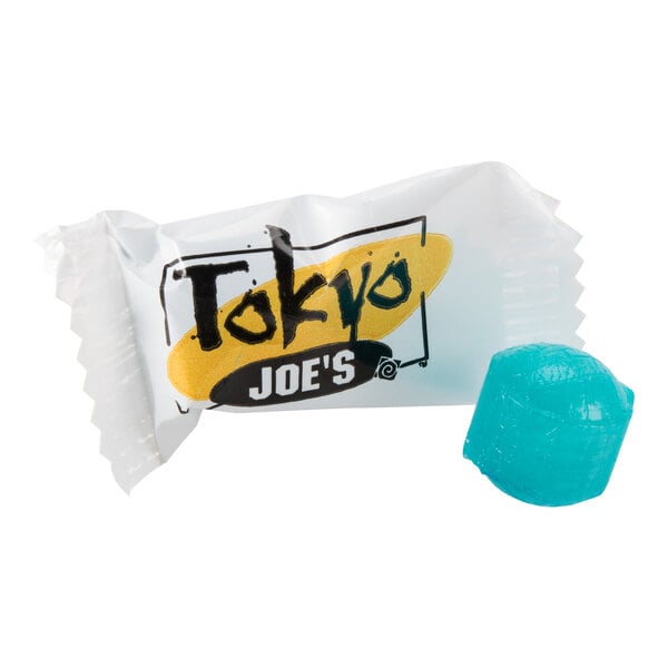 A blue hard candy is shown next to a clear wrapper labeled 'Tokyo Joe's.'