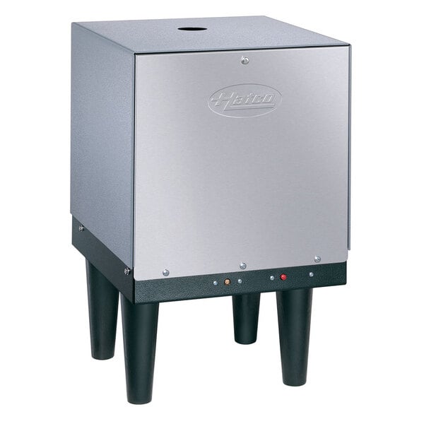 A silver and black Hatco Mini-Compact electric booster water heater.