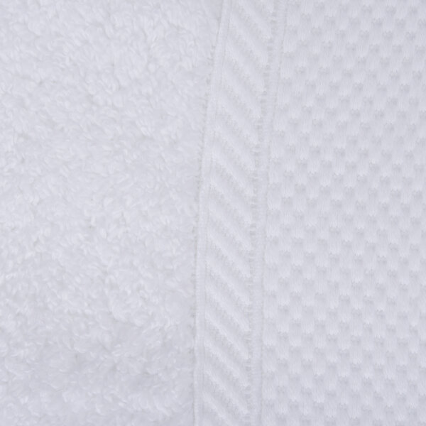 A close up of an Oxford Miasma white towel with a pattern.