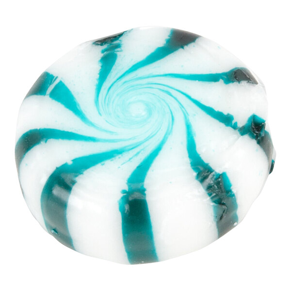 A round, white candy with blue-green swirled stripes in a spiral pattern.
