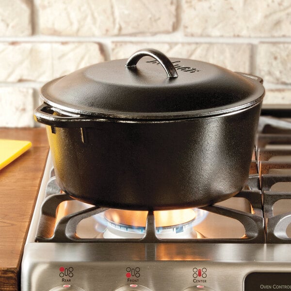 A Lodge pre-seasoned cast iron Dutch oven on a stove.