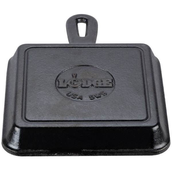 A square black Lodge cast iron skillet.