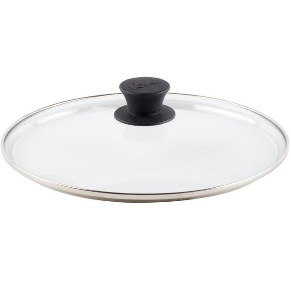 A Lodge glass lid with a black handle.