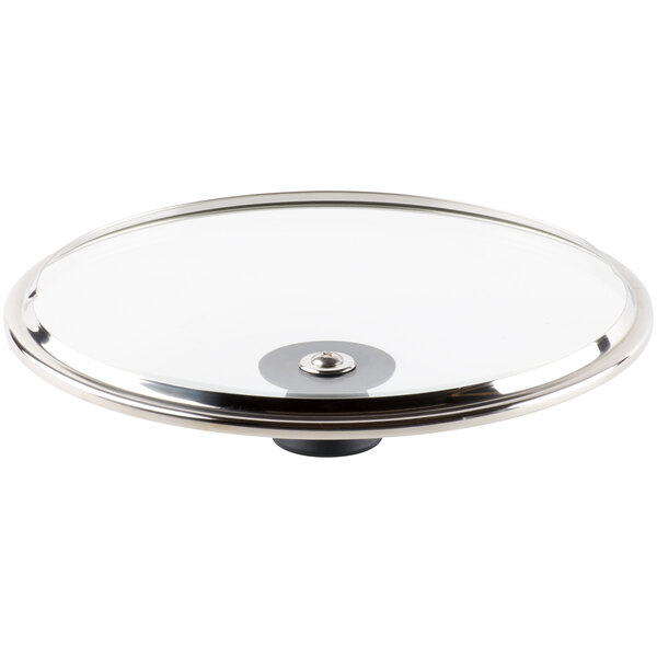 A Lodge tempered glass cover with a round metal handle.