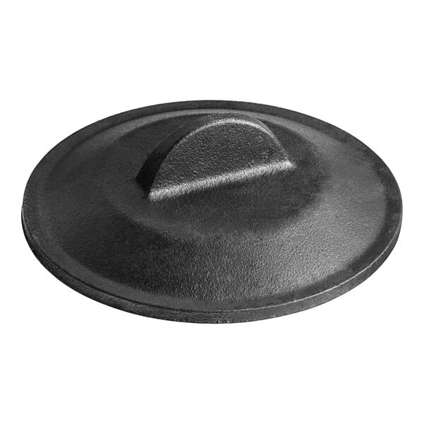 A black Lodge cast iron lid with a circular handle.