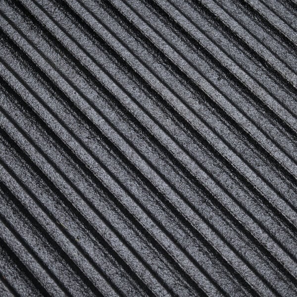 A close up of a Lodge square pre-seasoned cast iron grill pan.