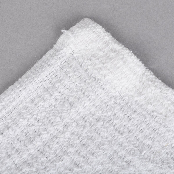 A close up of a white Chef Revival bar towel.