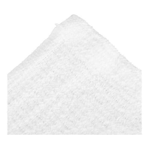 A close-up view of a white, textured, terry cloth fabric with visible stitching along the edge.
