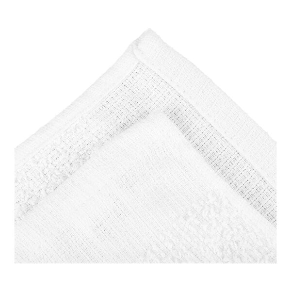 A close-up view of two overlapping white textured fabric towels with visible stitching along the edges.