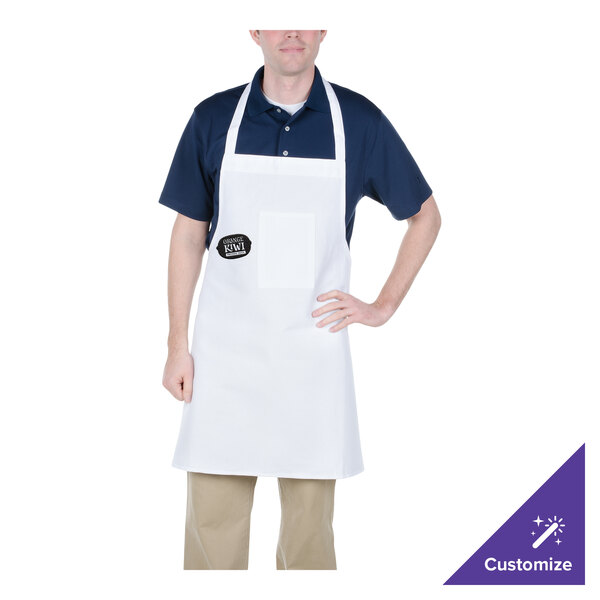 A man wearing a white Chef Revival bib apron with a black pocket.