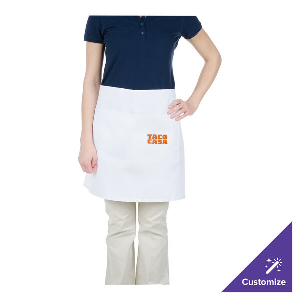 A woman wearing a white Chef Revival bistro apron.