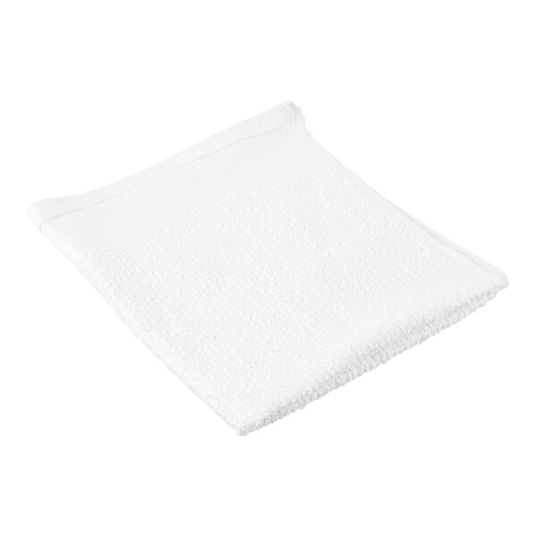 A white, rectangular, ribbed towel is shown folded on a plain background.
