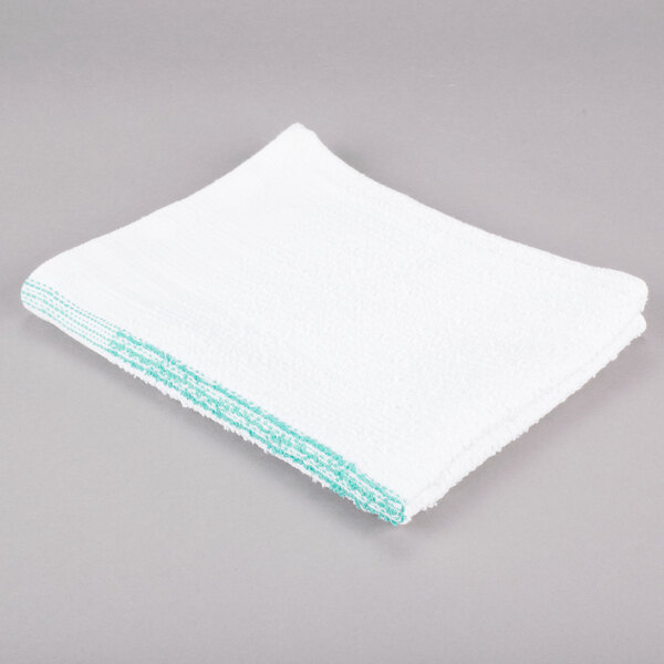 A white bar towel with green stripes on it.