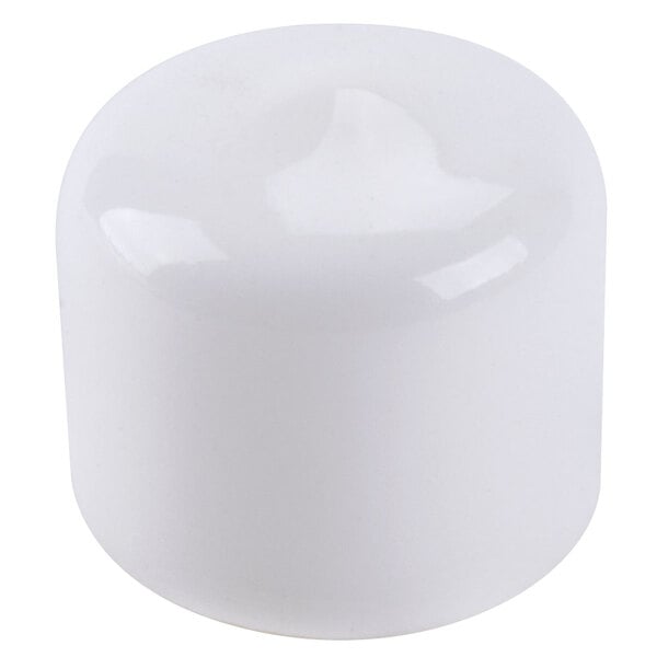 White plastic caps for Nemco Easy Cheese Blockers on a white surface.