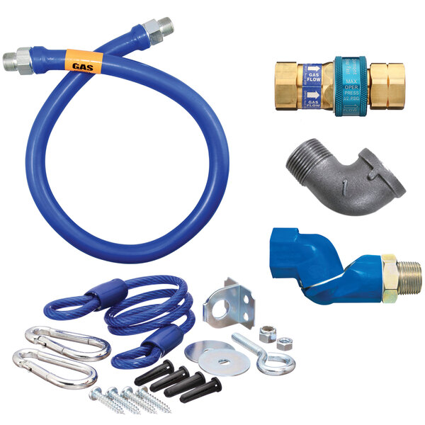 A blue Dormont gas connector kit with a flexible hose and various parts.