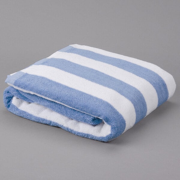 An Oxford blue and white striped pool towel.