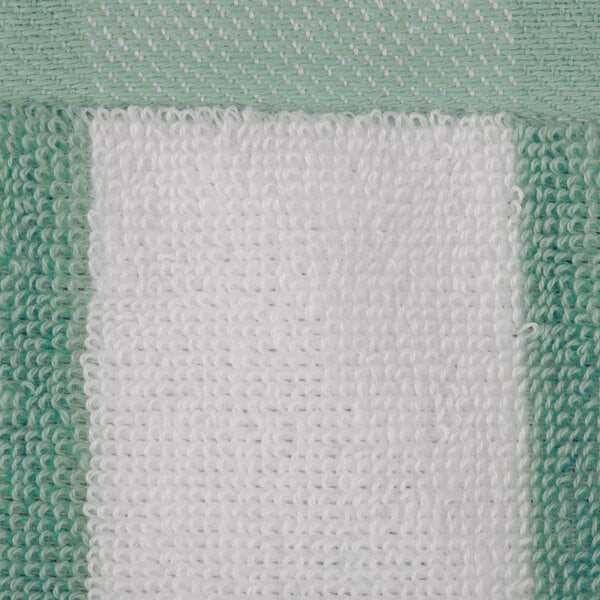 A close up of a mint green and white striped Oxford pool towel.