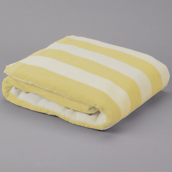 An Oxford yellow and white striped pool towel.