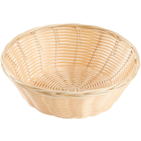 A round natural-colored rattan bread basket with a handle.