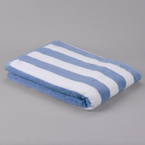 An Oxford blue and white striped pool towel.