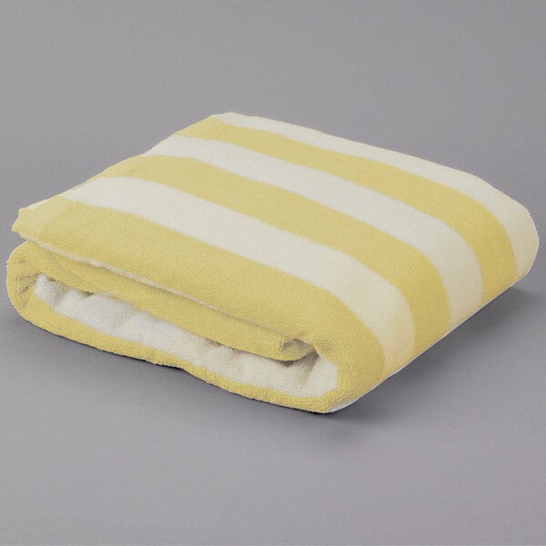 A yellow and white striped Oxford pool towel.