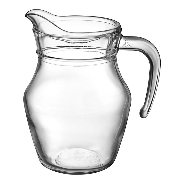 An Arcoroc clear glass pitcher with a handle.