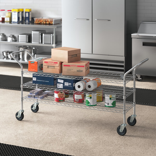 A Regency heavy duty utility cart with boxes on the shelves.