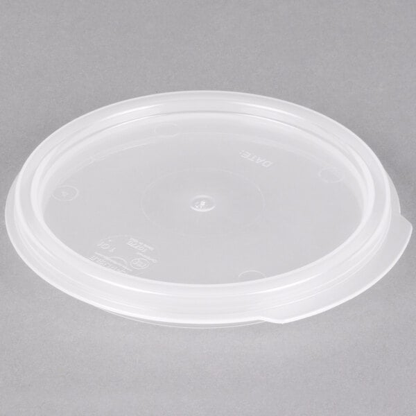 A Carlisle translucent plastic lid on a food storage container.